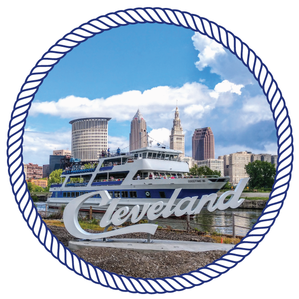 a sign "cleveland" on a mount, with the goodtimeiii boat in the background