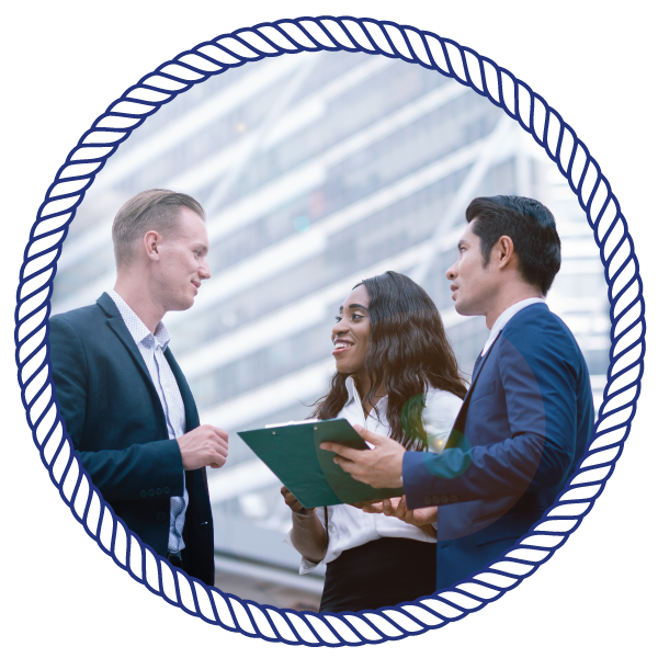 business partners talking, while holding a clipboard
